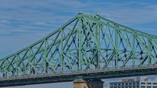 grey metal bridge during daytime in Pont Jacques-Cartier Canada