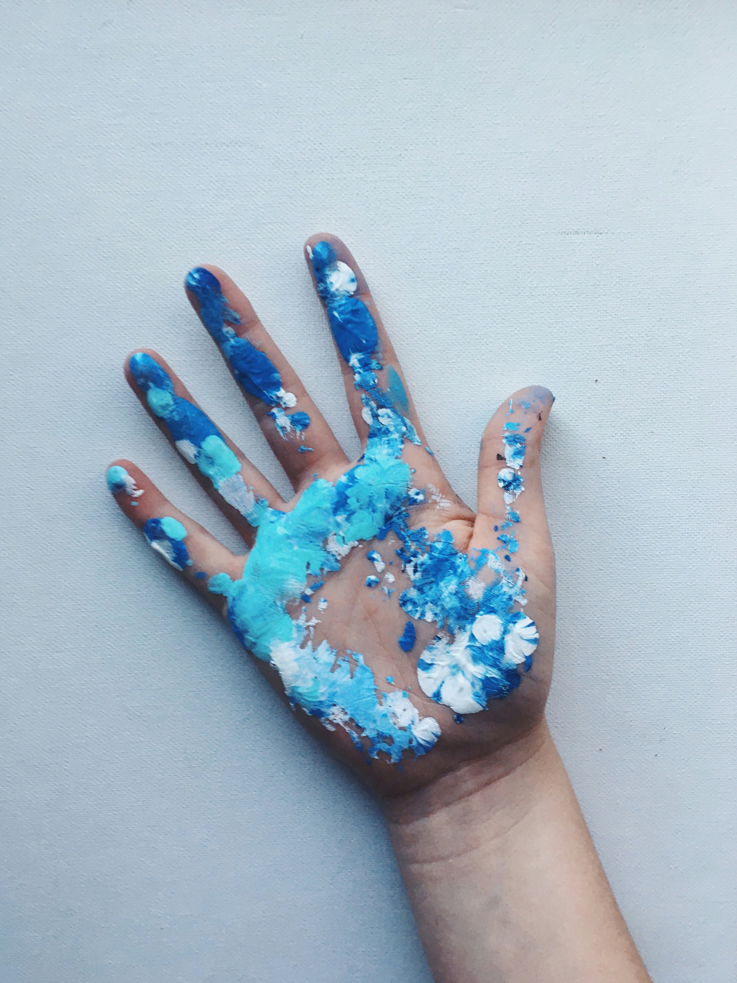 Right human hand with blue and white paint photo – Free Human Image on ...