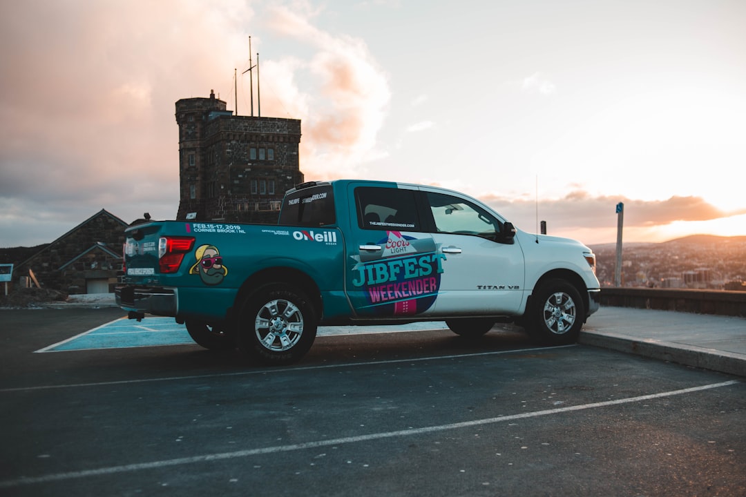 white and blue pickup truck photograph