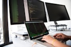shallow focus photo of person using MacBook