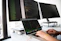 shallow focus photo of person using MacBook