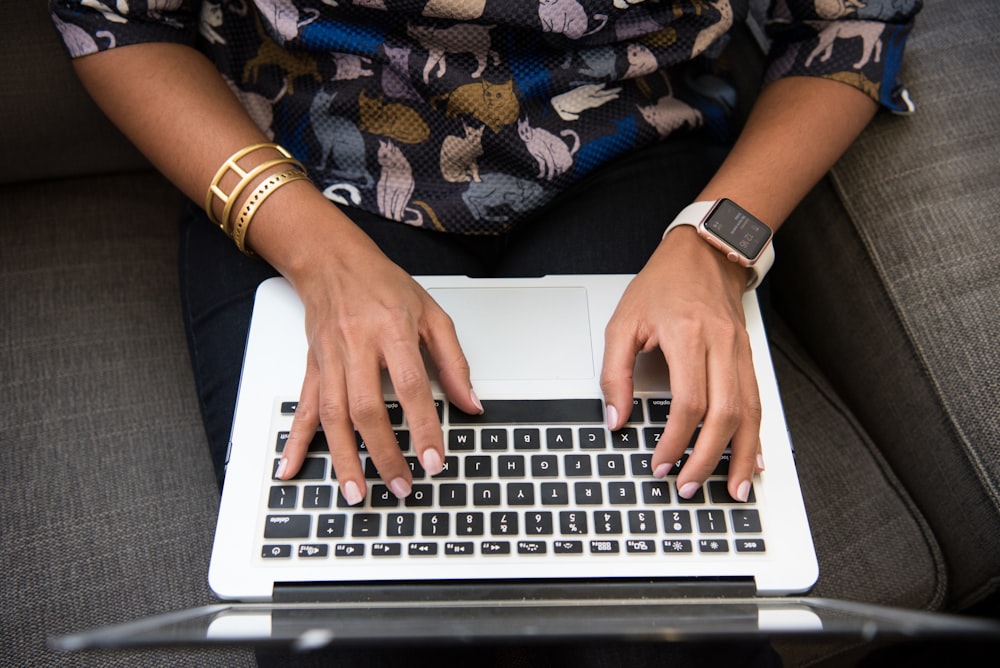 person typing on laptop