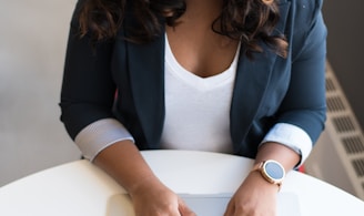 woman using MacBook laptop on table