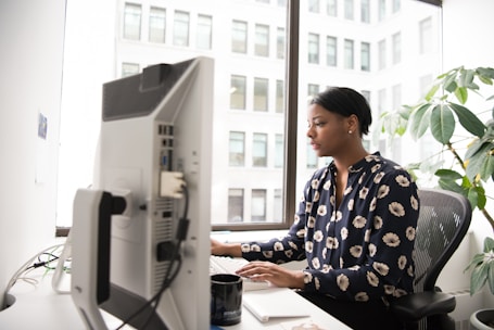 woman using desktop computer