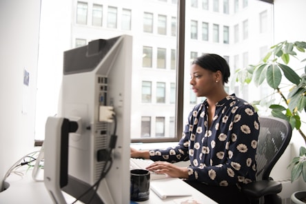 woman using desktop computer