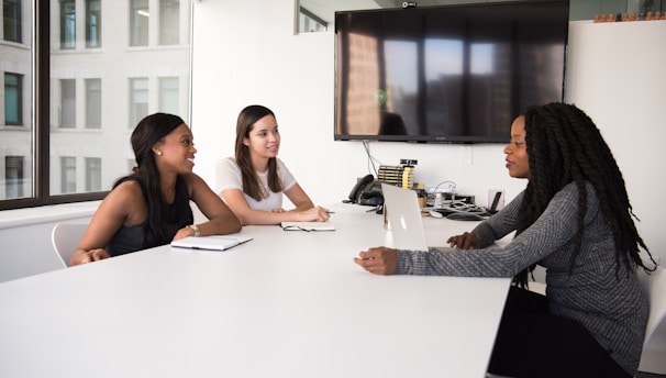 three women sitting at the table