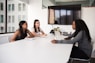 three women sitting at the table