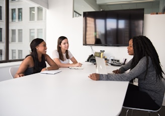 three women sitting at the table