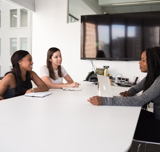 three women sitting at the table