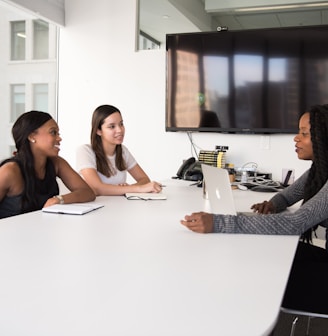 three women sitting at the table