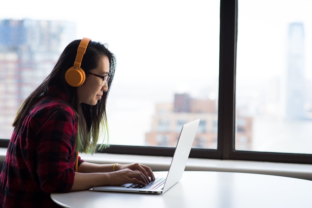 woman sitting in front of laptop