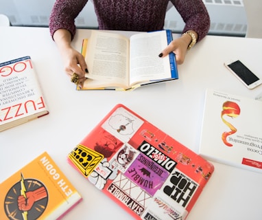 assorted-title books on table