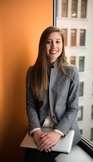 shallow focus photo of woman in gray jacket