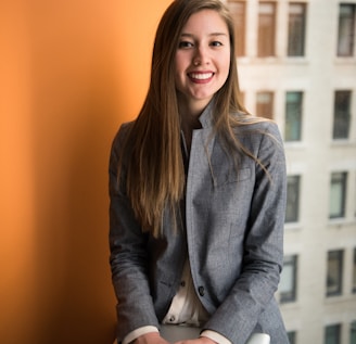 shallow focus photo of woman in gray jacket