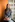 shallow focus photo of woman in gray jacket