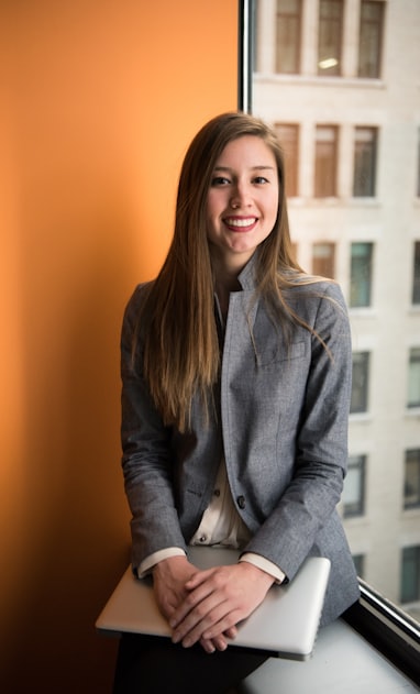 shallow focus photo of woman in gray jacket