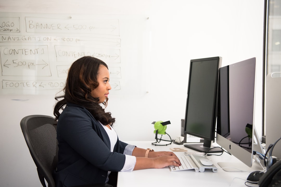 woman sitting infront of monitor