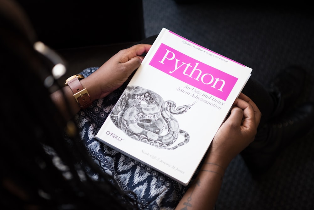 shallow focus photo of Python book