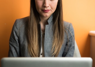 woman looking at MacBook