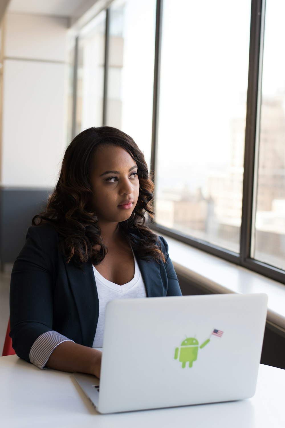 sitting woman using laptop computer