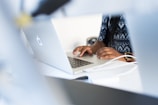 a person using a laptop computer on a desk