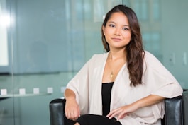 woman smiling and sitting