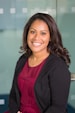 smiling woman wearing black cardigan