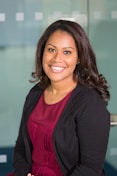 smiling woman wearing black cardigan
