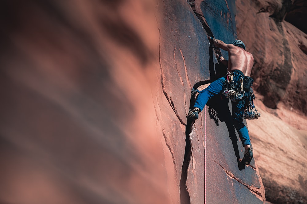 man climbing mountain