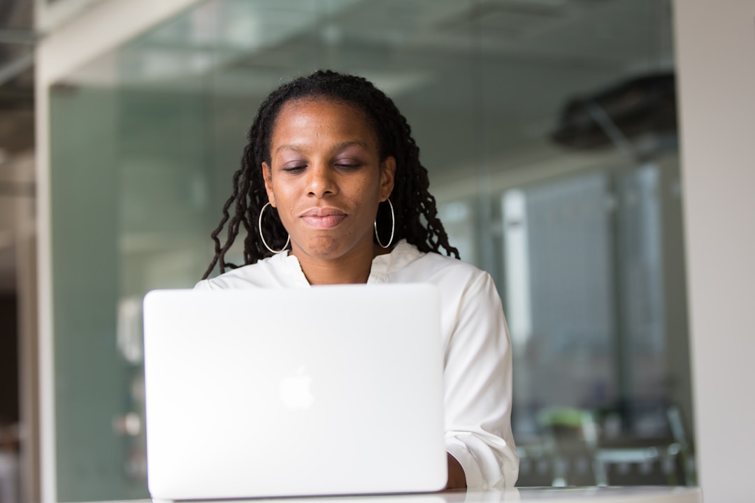 A woman working on her laptop, exploring advanced techniques for email monetization.