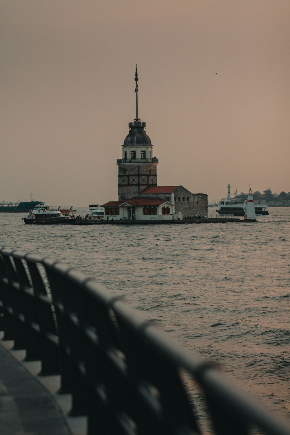 a light house sitting on top of a body of water