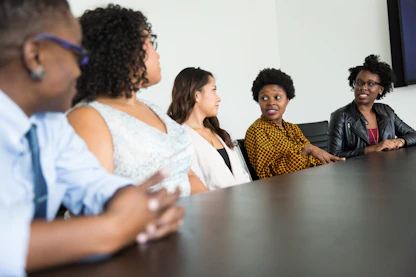 A diverse group of government officials and citizens in discussion.