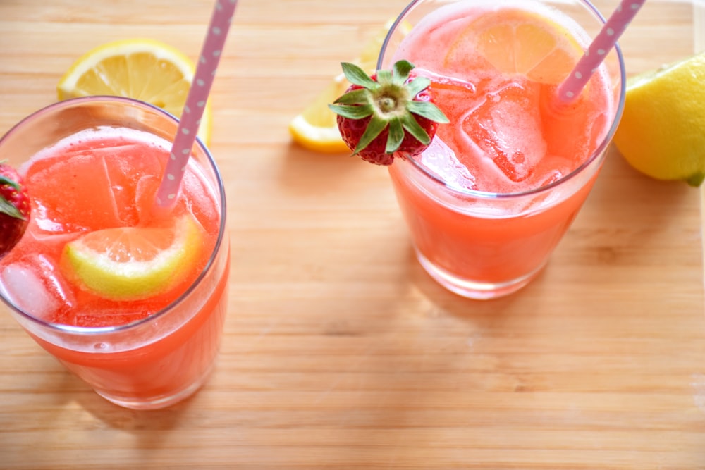 strawberry and lemon juice in highball glasses