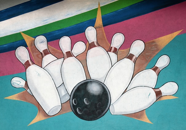 bowling ball crashing to bowling pins artwork