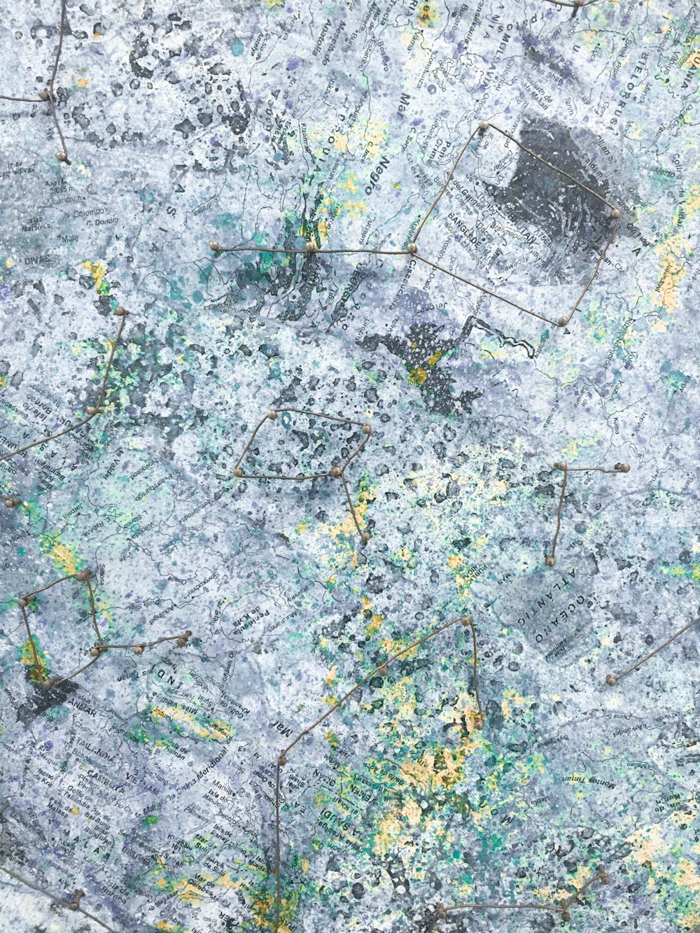 a grungy surface with yellow and green paint