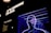 Bright neon outlines of human figures superimposed with a detailed sketch of a brain against a dark background. Above the figures, bold, illuminated text reads 'IT'S INSIDE US ALL'. There is also a small text panel on the left side with the title 'Where is the ECS?' and some descriptive text underneath.