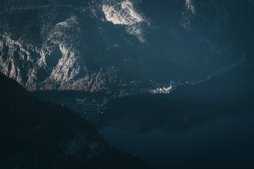 gray mountains and body of water