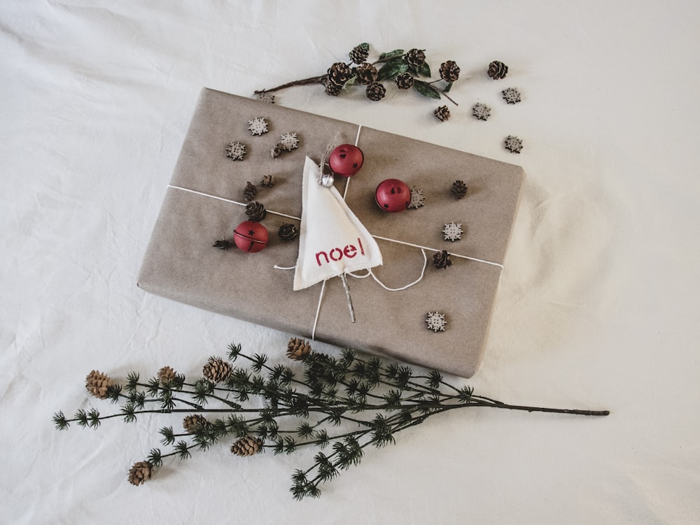 a present wrapped in brown paper with a tag on it