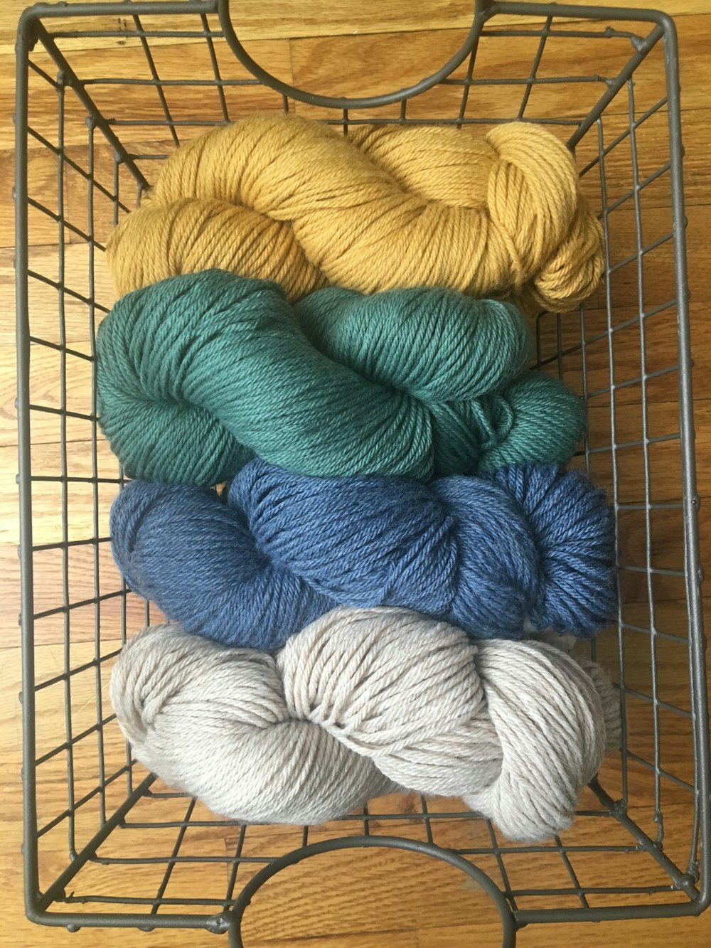 yellow, green, blue, and white yarn