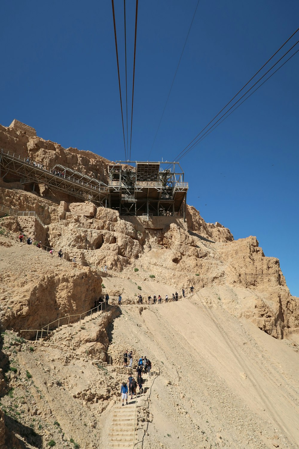 a group of people climbing up a mountain