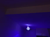 A freshly renovated room with new lighting fixtures glowing softly in baby blue hues.