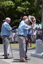 people standing near trees during day