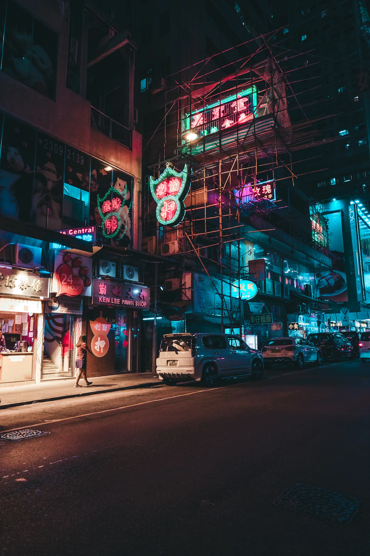 Neon signs illuminating a city street at night in Hong Kong