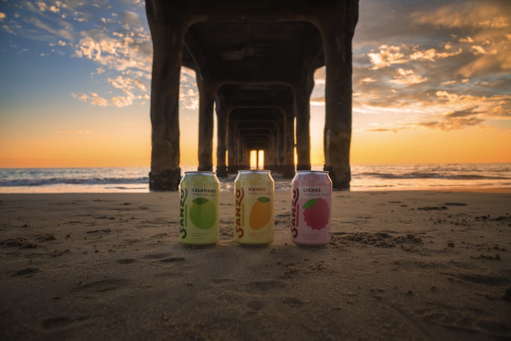 beverage cans under dock at beach