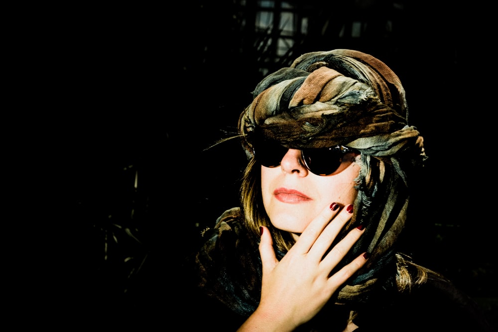woman wearing black frame sunglasses