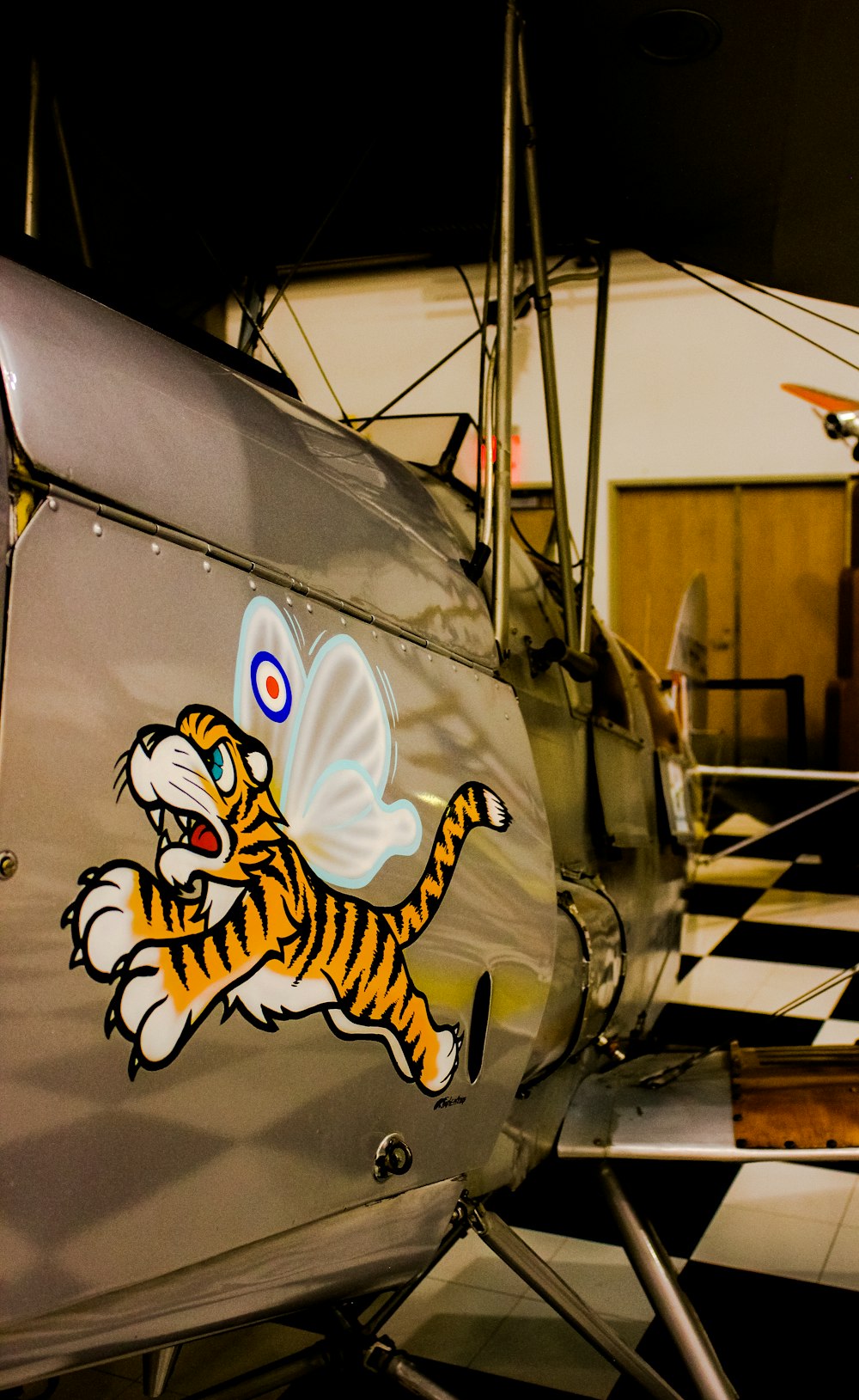 a close up of a plane with a tiger on it