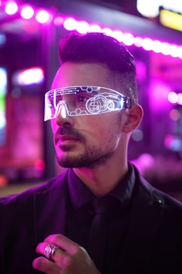 man wearing futuristic glasses implying a new age and advancements 