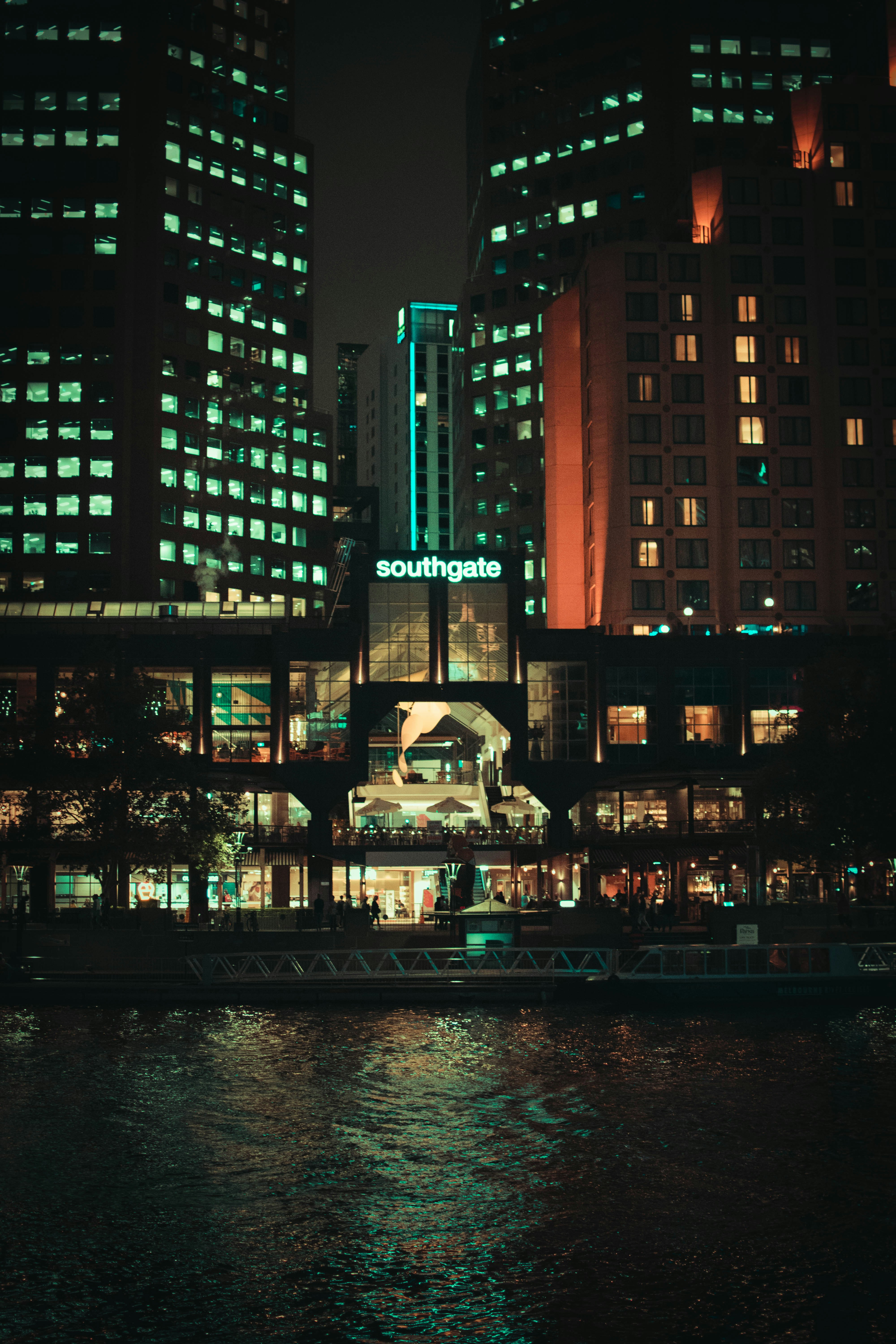 Lighted buildings near ocean photo – Free Building Image on Unsplash