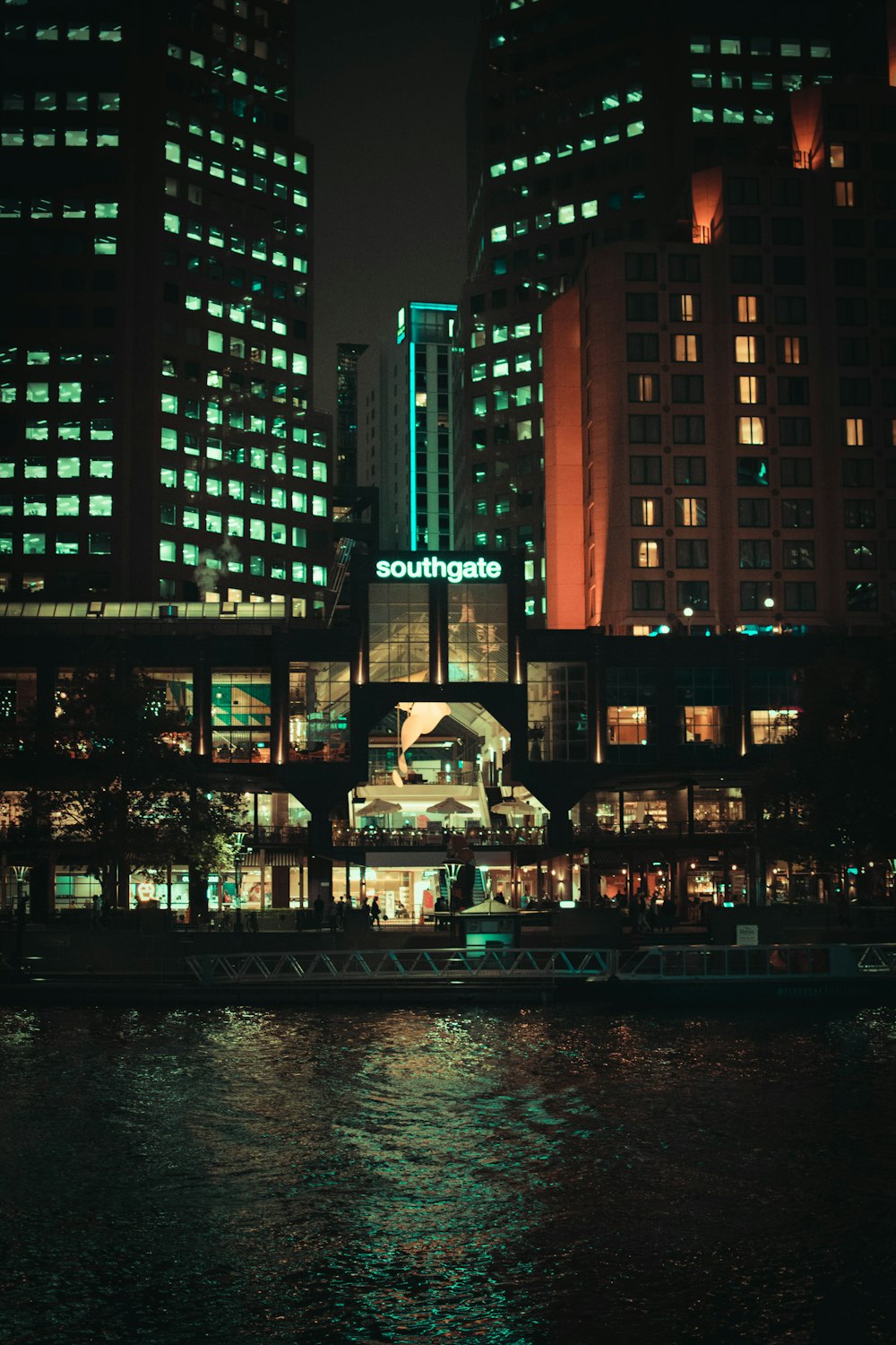 lighted buildings near ocean