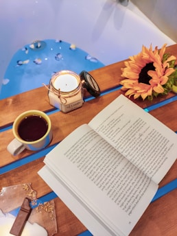 open book beside coffee mug
